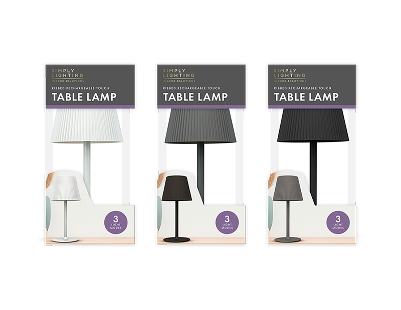 Three packages of Simply Lighting table lamps on a white background