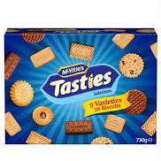 Tasties biscuits in a blue box, shown alongside a vertical blue label reading BISCUS and a black badge indicating 730 grams.