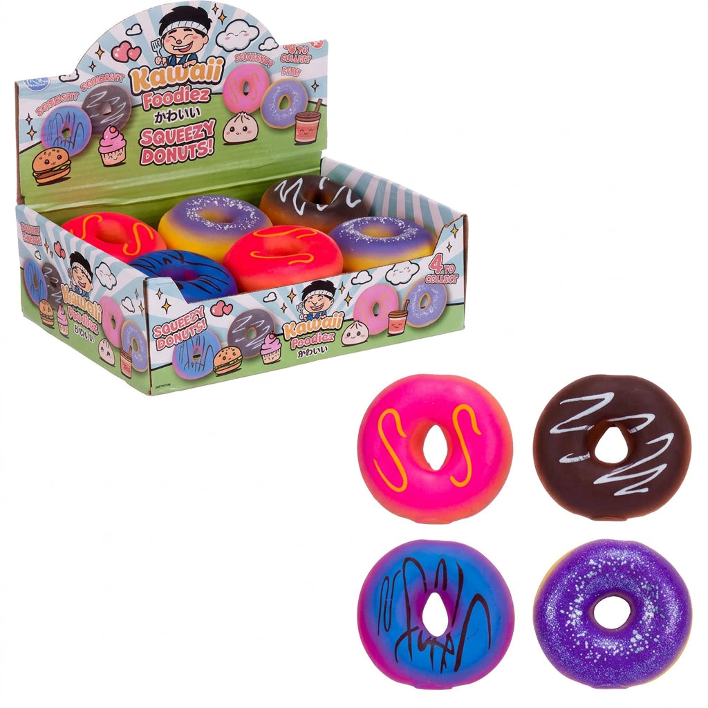 A display box of squishy donut toys with four individual donut-shaped toys shown below on a white background. The toys come in pink, brown, blue, and purple colors with various frosting patterns.